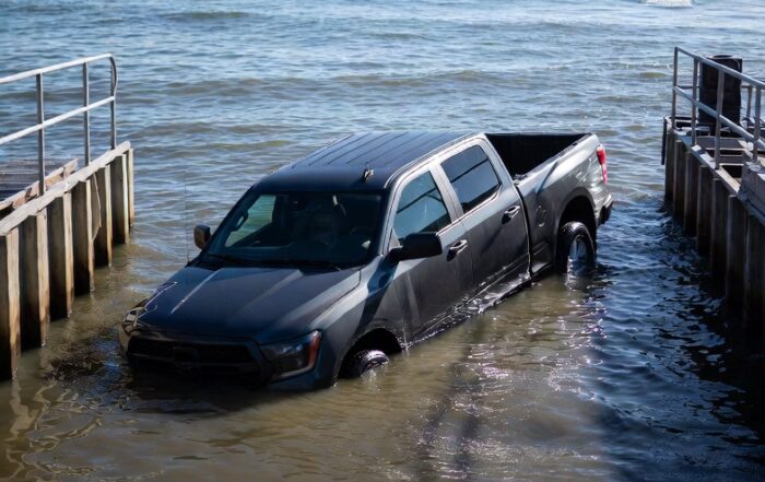 Pickup truck rolls into HOA lake